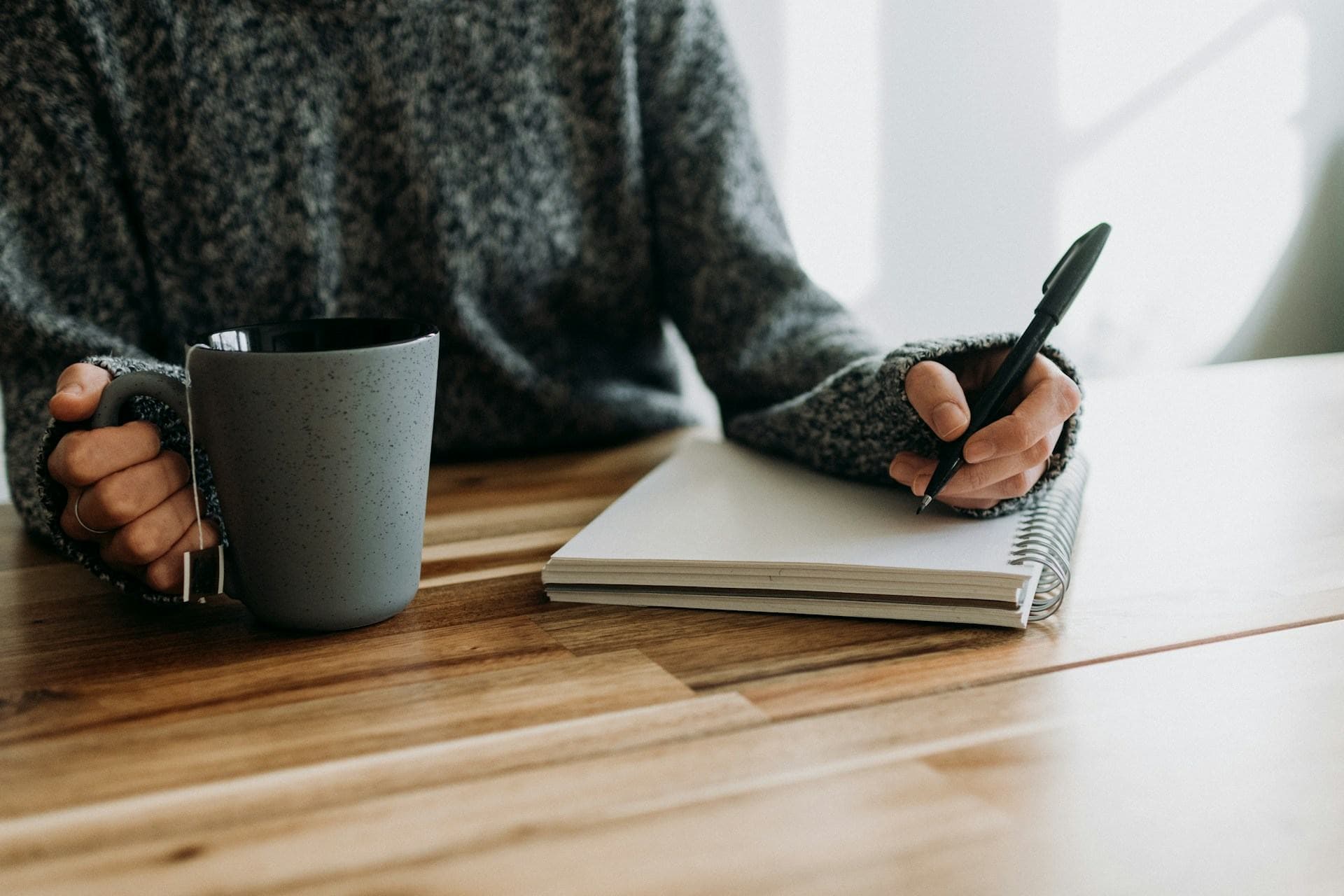 Planning notebook open on a desk